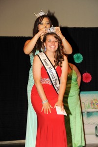 Kari Boles crouches down to be crowned 2014 Miss Marion Popcorn Festival queen at River Valley High School, Saturday, Aug. 2, 2014. For The Marion Star/Melanie Straka